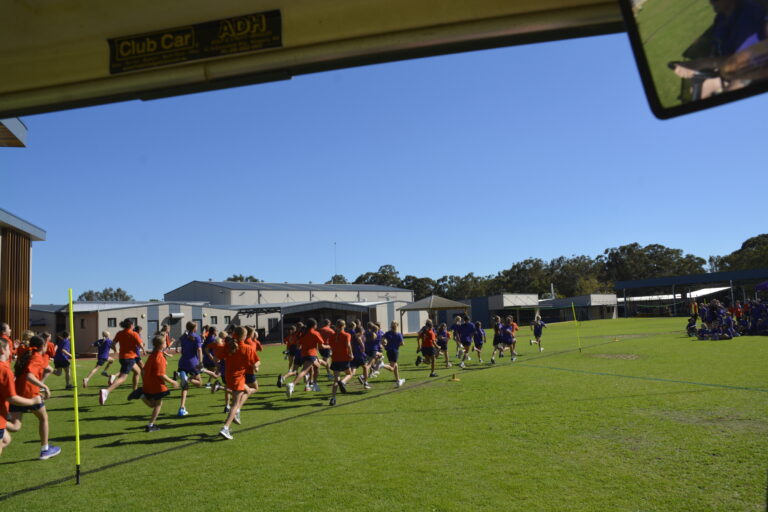 Students competing on the oval at the athletics carnival