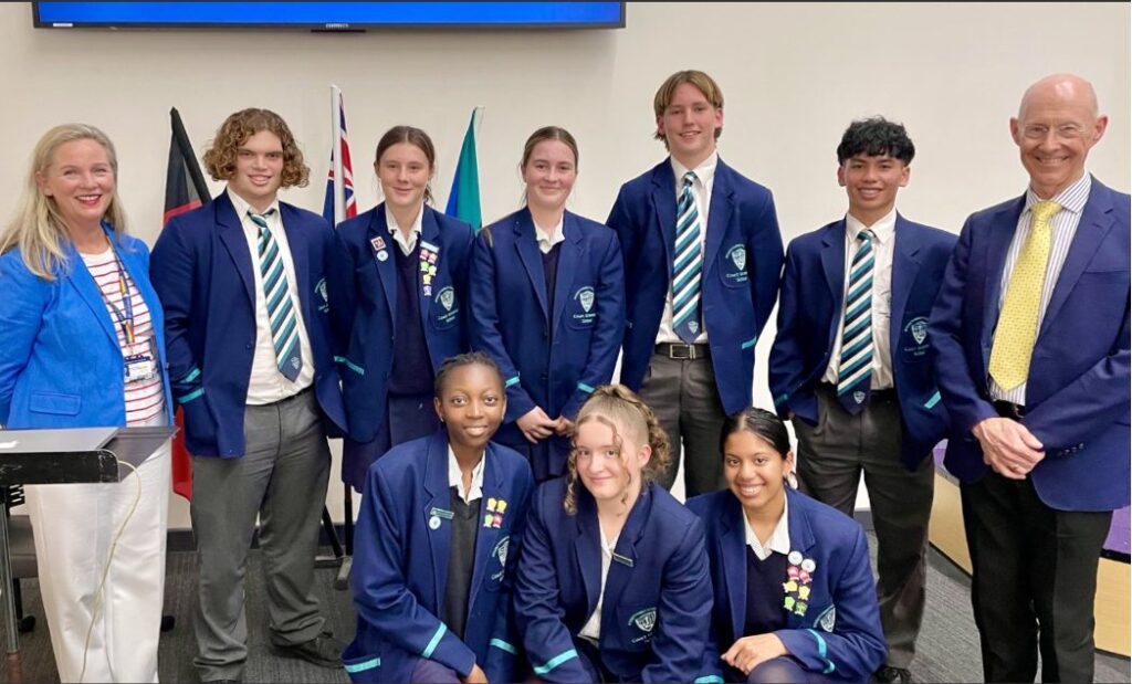 Student leaders standing with staff and guests at the leadership launch